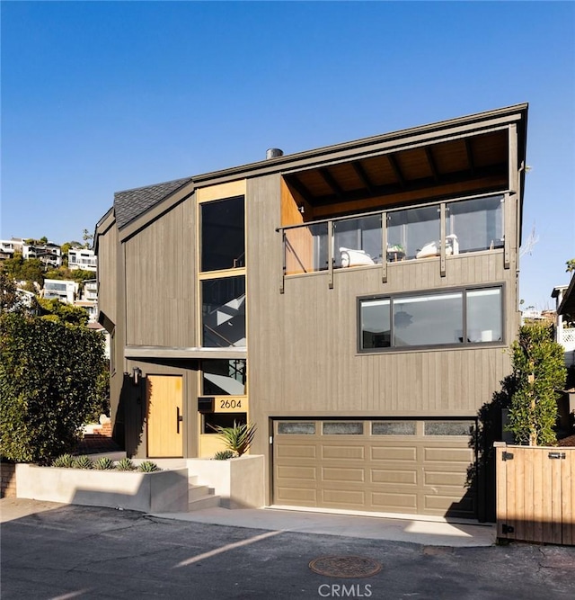 2604 Victoria Dr, Laguna Beach, CA 92651 - view of front of home featuring an attached garage and a balcony
