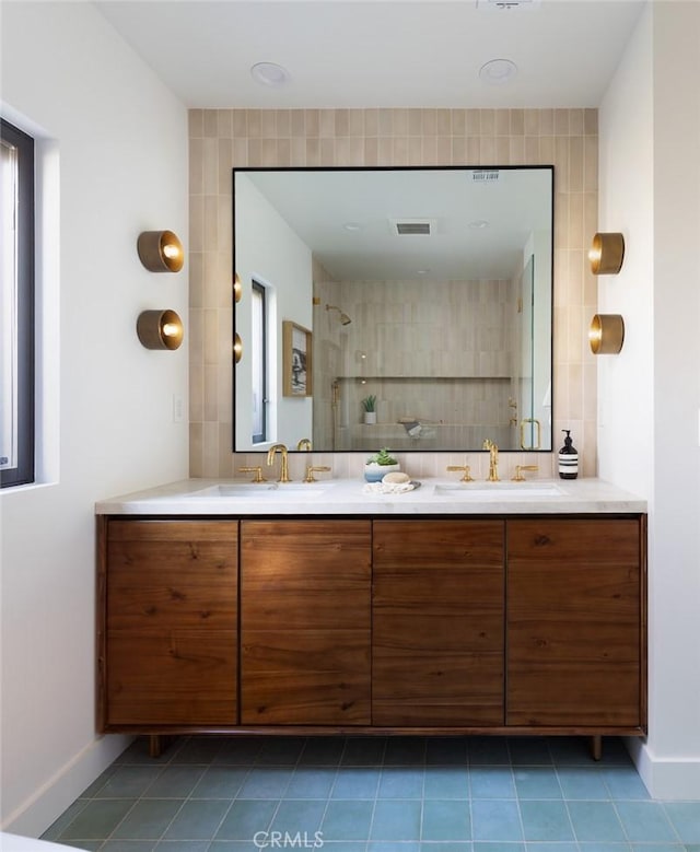 2604 Victoria Dr, Laguna Beach, CA 92651 - full bath featuring double vanity, tile patterned floors, tiled shower, and baseboards
