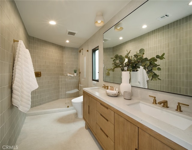 2604 Victoria Dr, Laguna Beach, CA 92651 - bathroom featuring double vanity, tiled shower, toilet, and recessed lighting