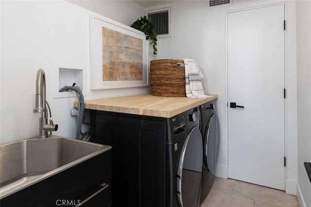 2604 Victoria Dr, Laguna Beach, CA 92651 - laundry room featuring washing machine and dryer and light tile patterned flooring