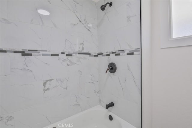 bathroom featuring bathtub / shower combination