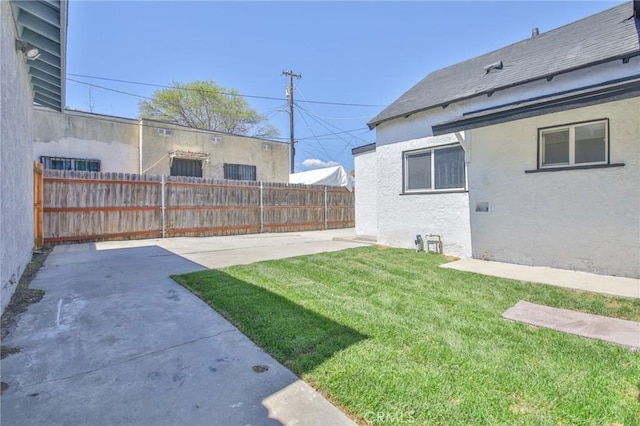 view of yard with a patio area and fence