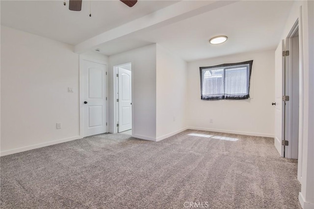 unfurnished bedroom featuring baseboards, carpet flooring, and ceiling fan