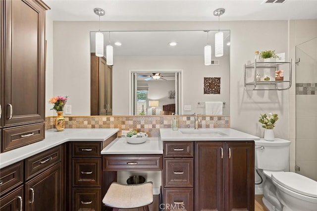 20140 Bouma Ct, Cerritos, CA 90703 - bathroom with ceiling fan, toilet, tasteful backsplash, vanity, and a shower