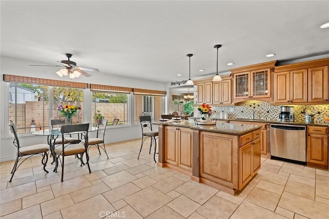 20140 Bouma Ct, Cerritos, CA 90703 - kitchen featuring dishwasher, dark stone countertops, a center island, tasteful backsplash, and recessed lighting