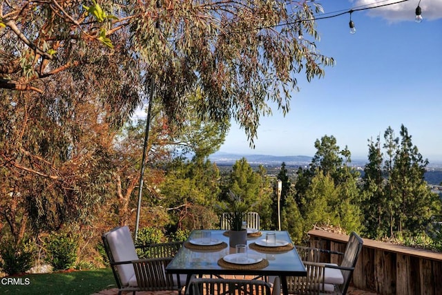 wooden deck featuring outdoor dining area