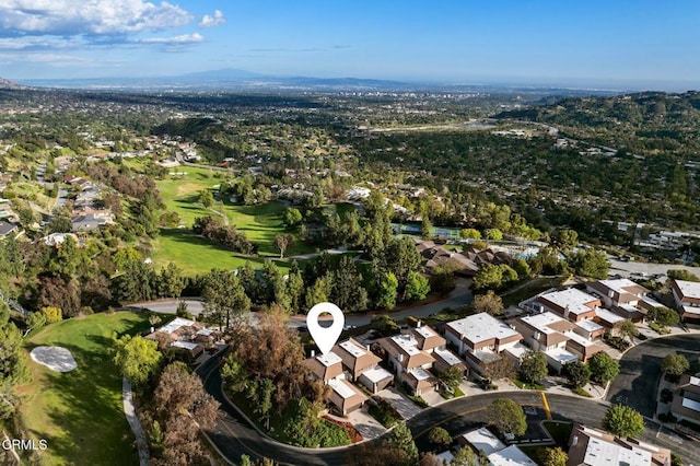 birds eye view of property featuring view of golf course and a residential view