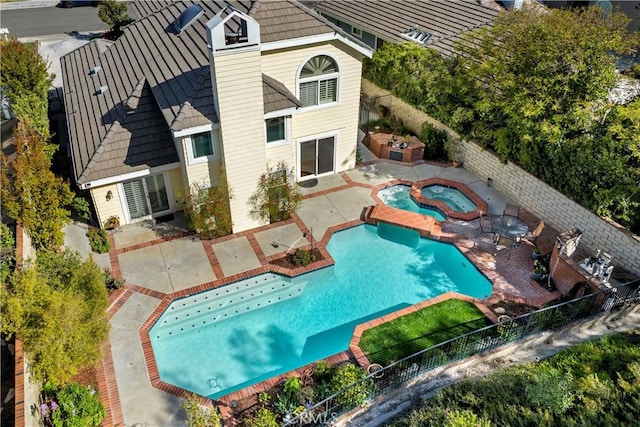 24118 Saint Moritz Dr, Valencia, CA 91355 - view of swimming pool featuring a patio area, an in-ground hot tub, and a fenced backyard