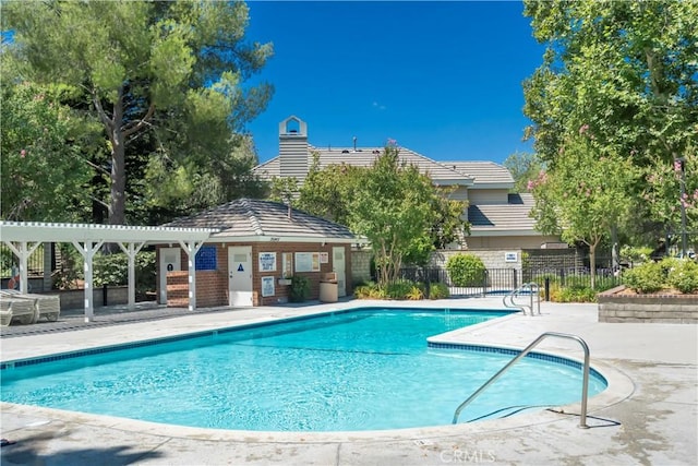 24118 Saint Moritz Dr, Valencia, CA 91355 - community pool featuring a patio and an outbuilding
