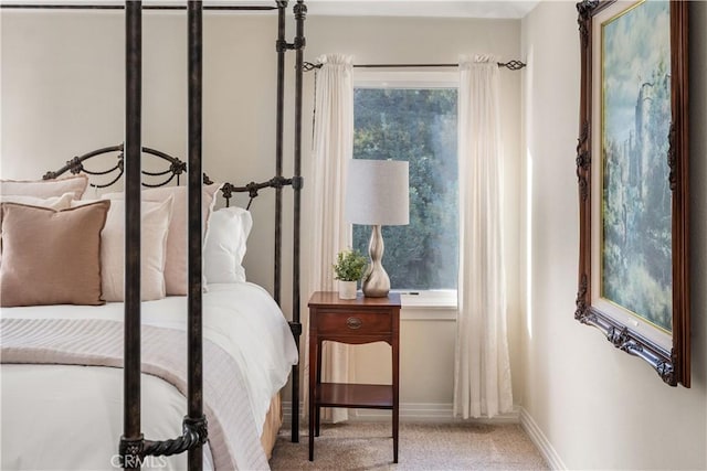 carpeted bedroom with baseboards