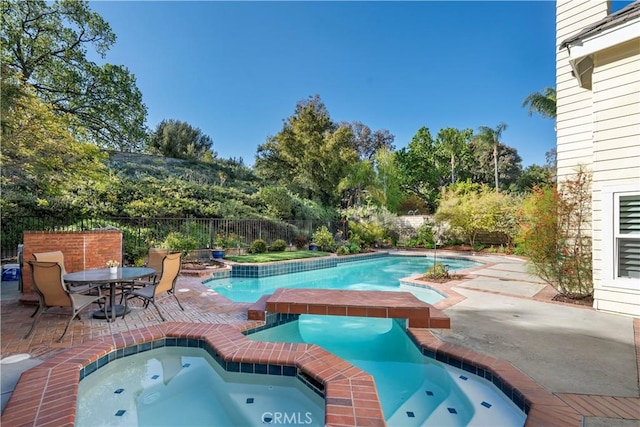 24118 Saint Moritz Dr, Valencia, CA 91355 - view of pool with an in-ground hot tub, a patio area, and view of wooded area