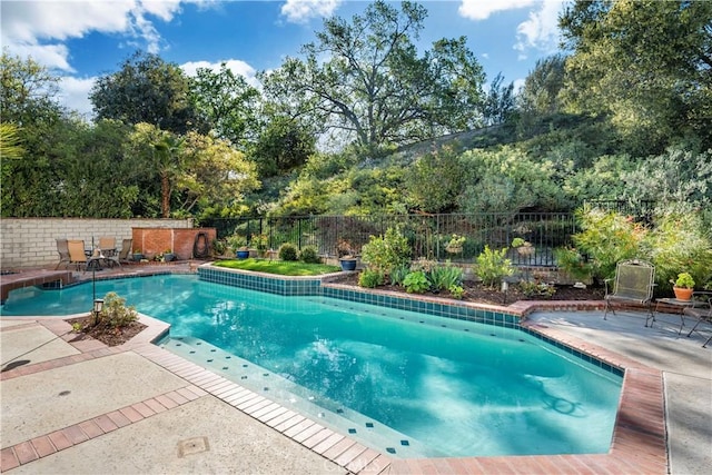 24118 Saint Moritz Dr, Valencia, CA 91355 - view of pool featuring a fenced backyard, a patio area, and view of wooded area