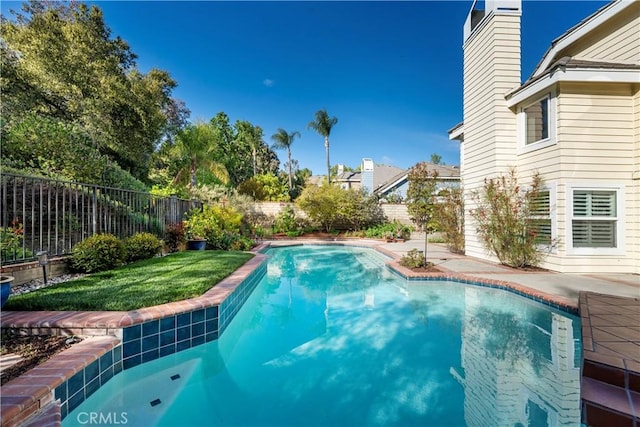 view of pool featuring a fenced backyard, a yard, and a fenced in pool