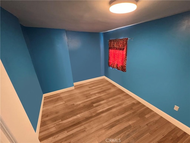 1708 E 3rd St, Los Angeles, CA 90033 - empty room with baseboards and wood finished floors