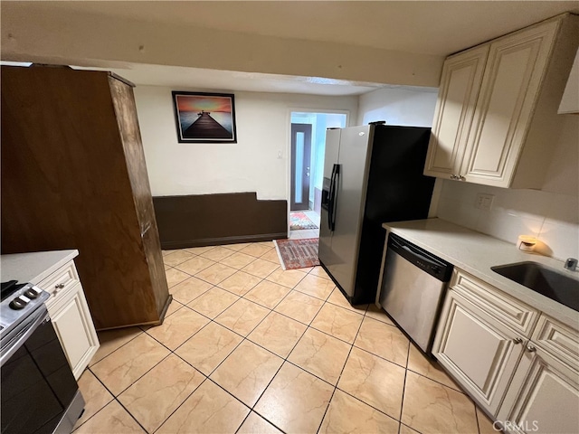 1708 E 3rd St, Los Angeles, CA 90033 - kitchen featuring a sink, light countertops, and stainless steel appliances