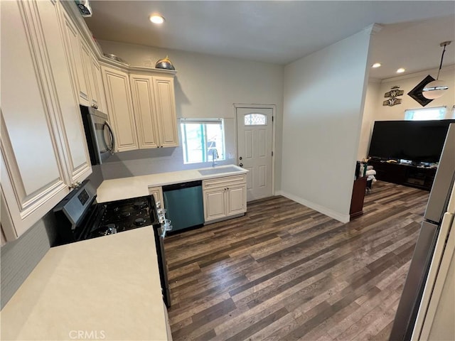 1708 E 3rd St, Los Angeles, CA 90033 - kitchen featuring a sink, light countertops, dark wood finished floors, and dishwashing machine