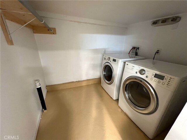 1708 E 3rd St, Los Angeles, CA 90033 - laundry area with baseboards, washing machine and dryer, and laundry area