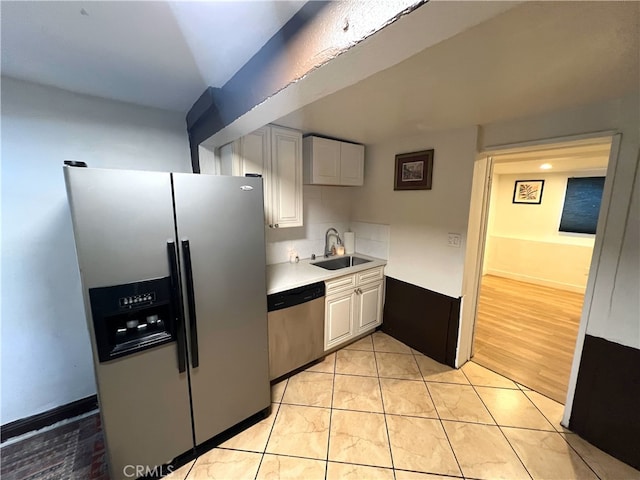 1708 E 3rd St, Los Angeles, CA 90033 - kitchen featuring a sink, light countertops, appliances with stainless steel finishes, and decorative backsplash