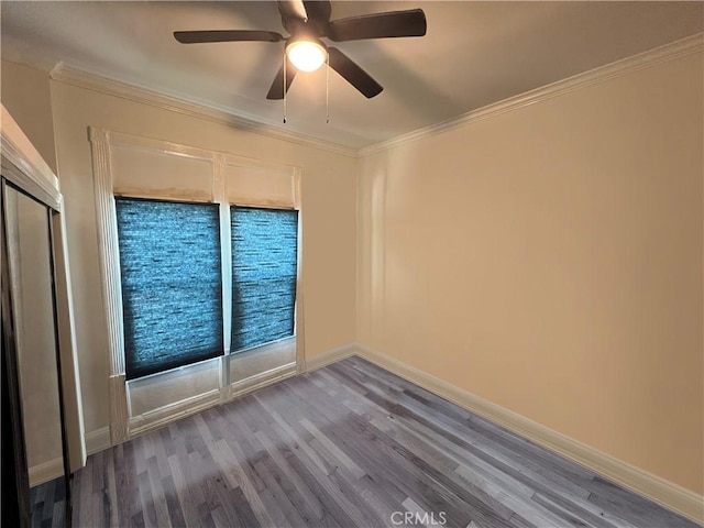 1708 E 3rd St, Los Angeles, CA 90033 - spare room featuring crown molding, baseboards, ceiling fan, and wood finished floors