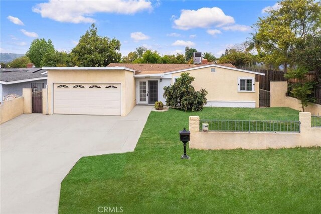ranch-style home with an attached garage, a front lawn, concrete driveway, and fence