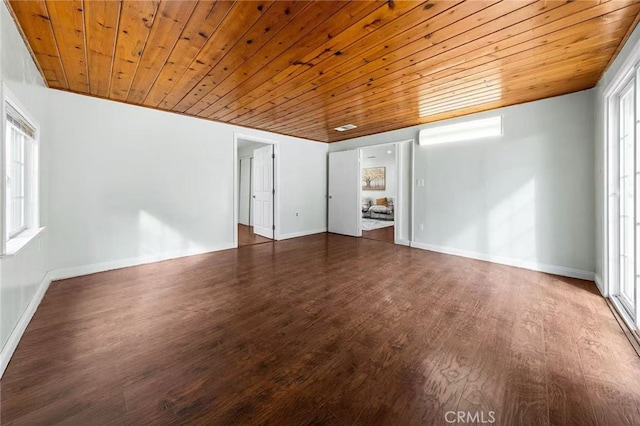 interior space featuring wood finished floors, a wealth of natural light, and wooden ceiling