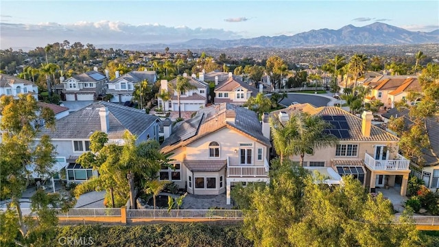 bird's eye view with a residential view and a mountain view