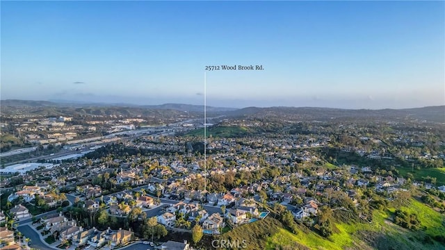 drone / aerial view featuring a mountain view and a residential view