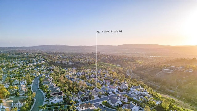 aerial view featuring a mountain view and a residential view