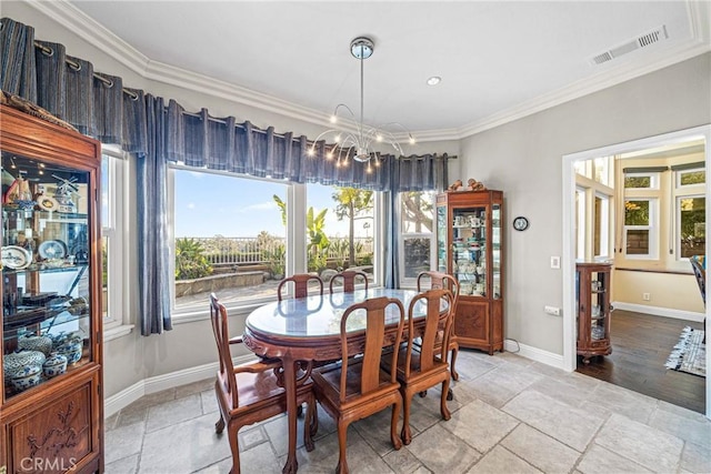 dining room featuring stone tile floors, baseboards, visible vents, a chandelier, and ornamental molding