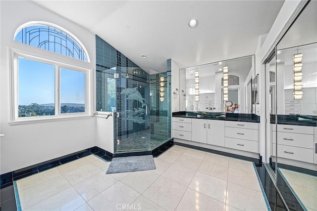 full bath featuring recessed lighting, tile patterned flooring, vanity, baseboards, and a stall shower