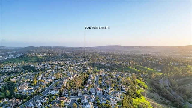 bird's eye view featuring a residential view and a mountain view