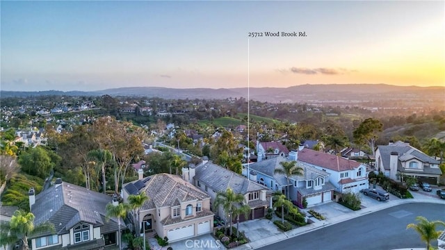 bird's eye view featuring a residential view and a mountain view