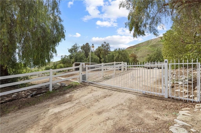 18181 Lost Creek Rd, Saugus, CA 91390 - gate featuring fence, a rural view, and a mountain view