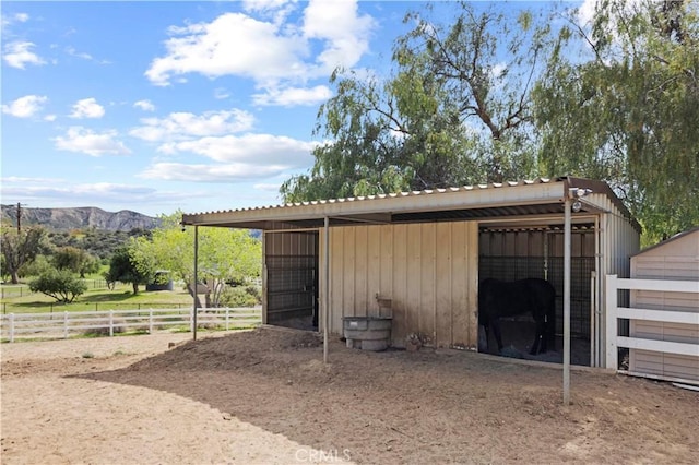 view of stable with a mountain view