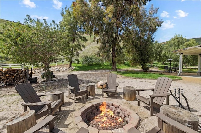 view of patio / terrace with an outdoor fire pit