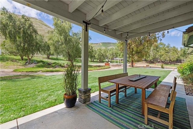 view of patio / terrace with a mountain view
