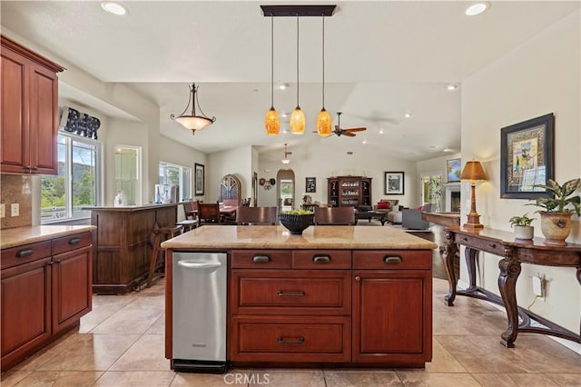kitchen featuring hanging light fixtures, a center island, recessed lighting, and lofted ceiling