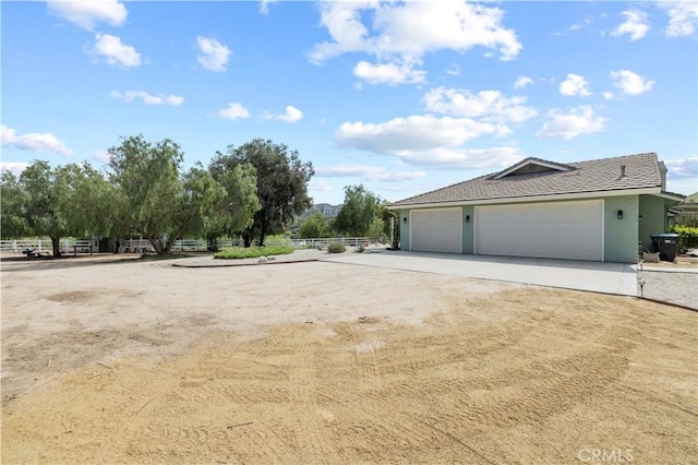 18181 Lost Creek Rd, Saugus, CA 91390 - view of home's exterior featuring driveway and stucco siding