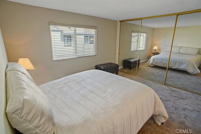 carpeted bedroom featuring a closet