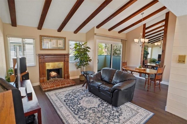 living room with an inviting chandelier, a fireplace, dark wood finished floors, baseboards, and vaulted ceiling with beams