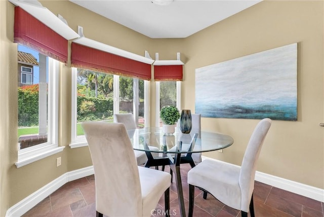 dining area featuring baseboards