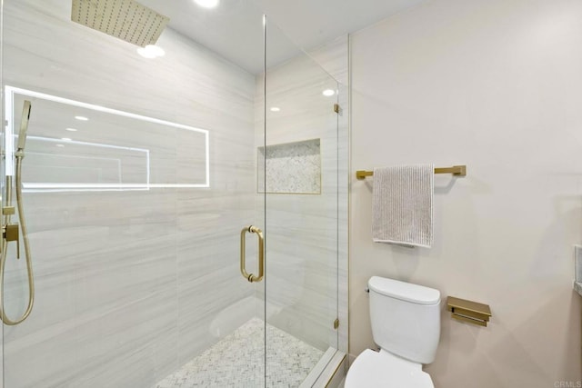 full bath featuring recessed lighting, a shower stall, and toilet