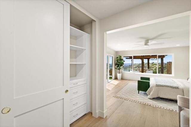bedroom featuring ceiling fan and light wood-style floors