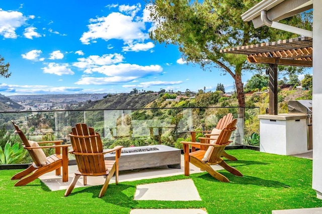 balcony with a grill, an outdoor fire pit, a patio area, and a pergola