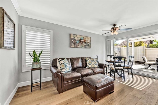 9 Las Piedras, Rancho Santa Margarita, CA 92688 - living area with crown molding, baseboards, ceiling fan, and light wood-type flooring
