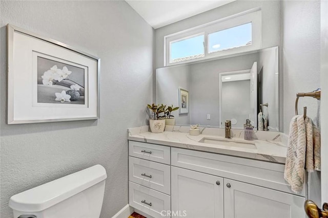 9 Las Piedras, Rancho Santa Margarita, CA 92688 - bathroom with toilet, vanity, and a textured wall
