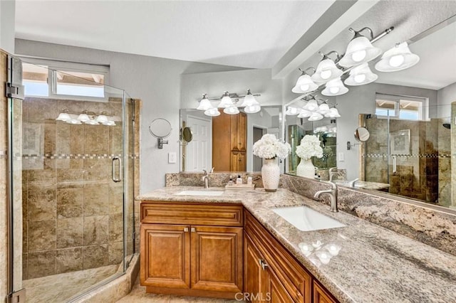 9 Las Piedras, Rancho Santa Margarita, CA 92688 - full bathroom featuring a stall shower, double vanity, and a sink