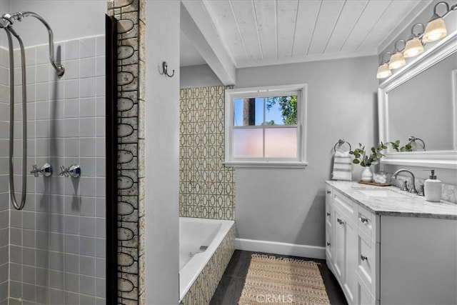 full bathroom with vanity, crown molding, a tile shower, a relaxing tiled tub, and baseboards