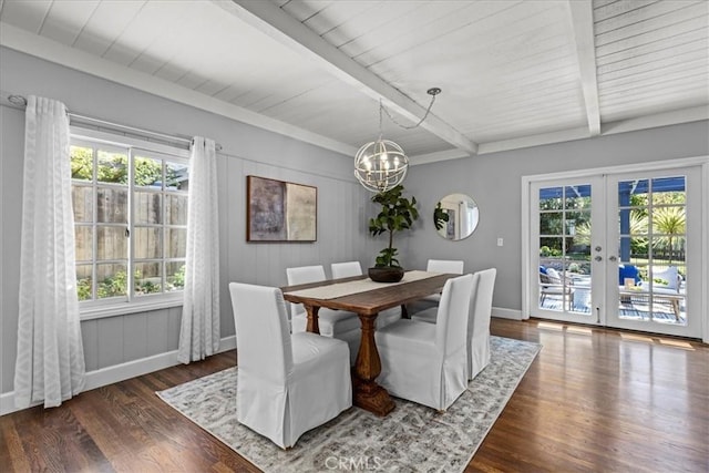 dining area with beam ceiling, french doors, a chandelier, wood finished floors, and baseboards