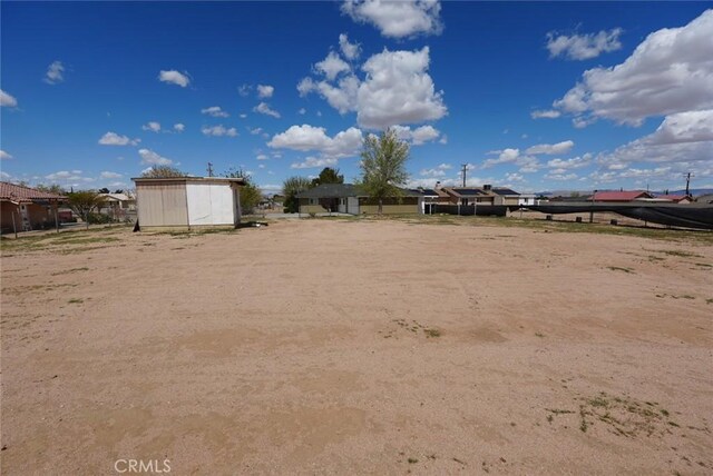 16621 Verano St, Hesperia, CA 92345 - view of yard featuring a shed and an outbuilding